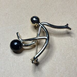 Elegant Gold and Black bowling Brooch